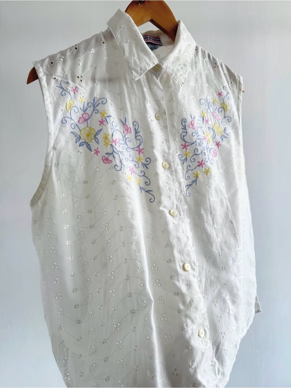 White Sleeveless Button-Up Blouse with Pastel Floral Embroidery